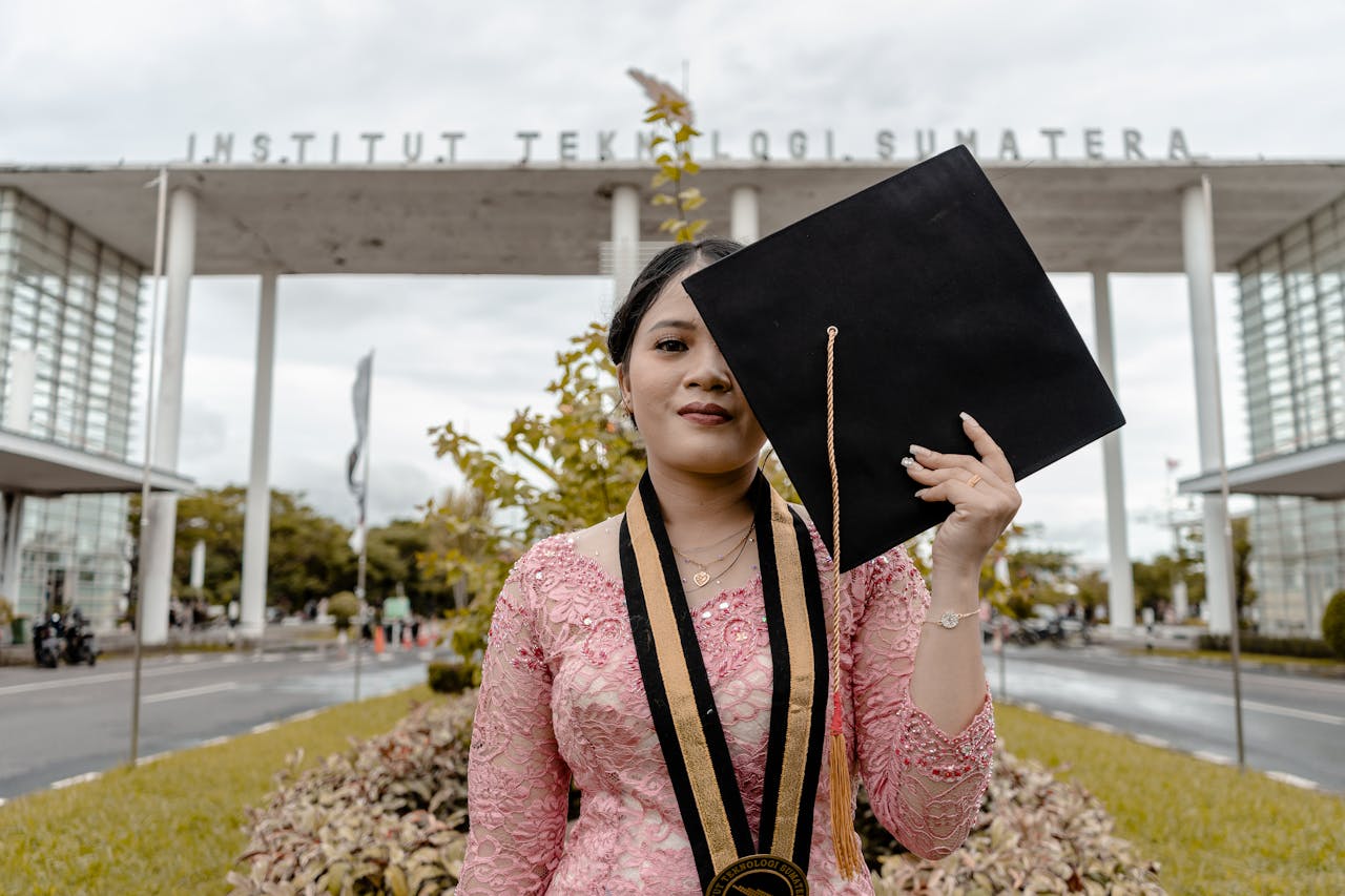 services-03 Asian female graduate posing with cap at Institut Teknologi Sumatera.